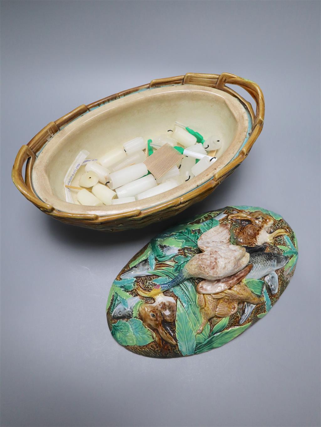 A George Jones maiolica game pie dish, liner and cover, width 32cm height 21cm
